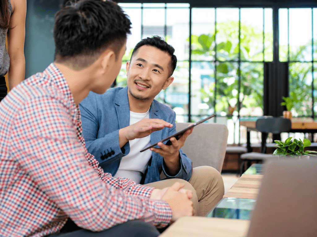 Accountant in a friendly discussion with a client at an office table