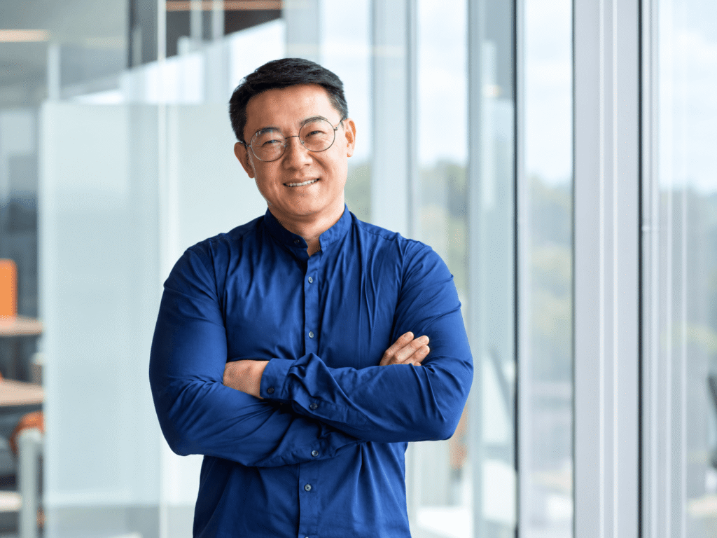 Smiling professional standing in a modern office